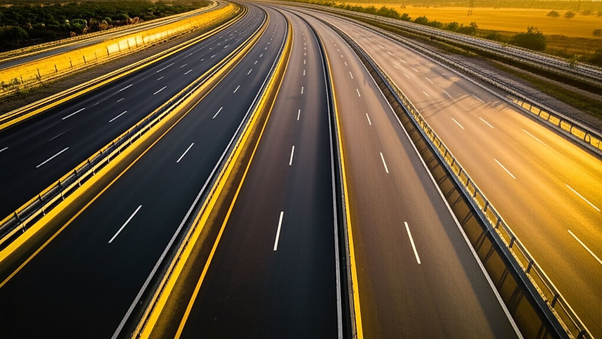 Architectural photograph showcasing the NH-56 four-lane expressway in Gujarat. Capture a sweeping perspective of the highway smoothly transitioning through a scenic landscape, characteristic of rural Gujarat. Golden hour lighting with warm, diffused sunlight casting long shadows across the asphalt. Focus on the highway's clean lines, modern infrastructure elements (signage, barriers), and integration with the surrounding environment. Professional architectural photography, high resolution, shallow depth of field highlighting the road's texture and distant landscape, emphasizing scale and progress.. Professional architectural photography, ultra-high quality, sharp focus, vivid colors, dramatic lighting, golden hour, cinematic composition, 8K UHD, photorealistic.